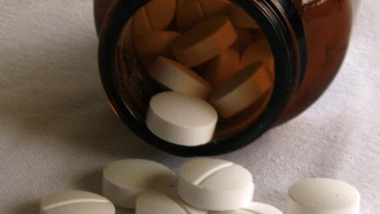 Tablets fall from a jar