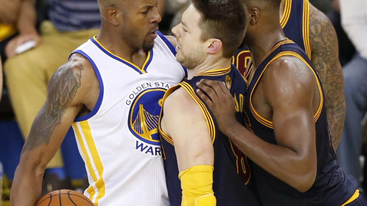 Cleveland Cavaliers players Matthew Dellavedova of Australia (CL)