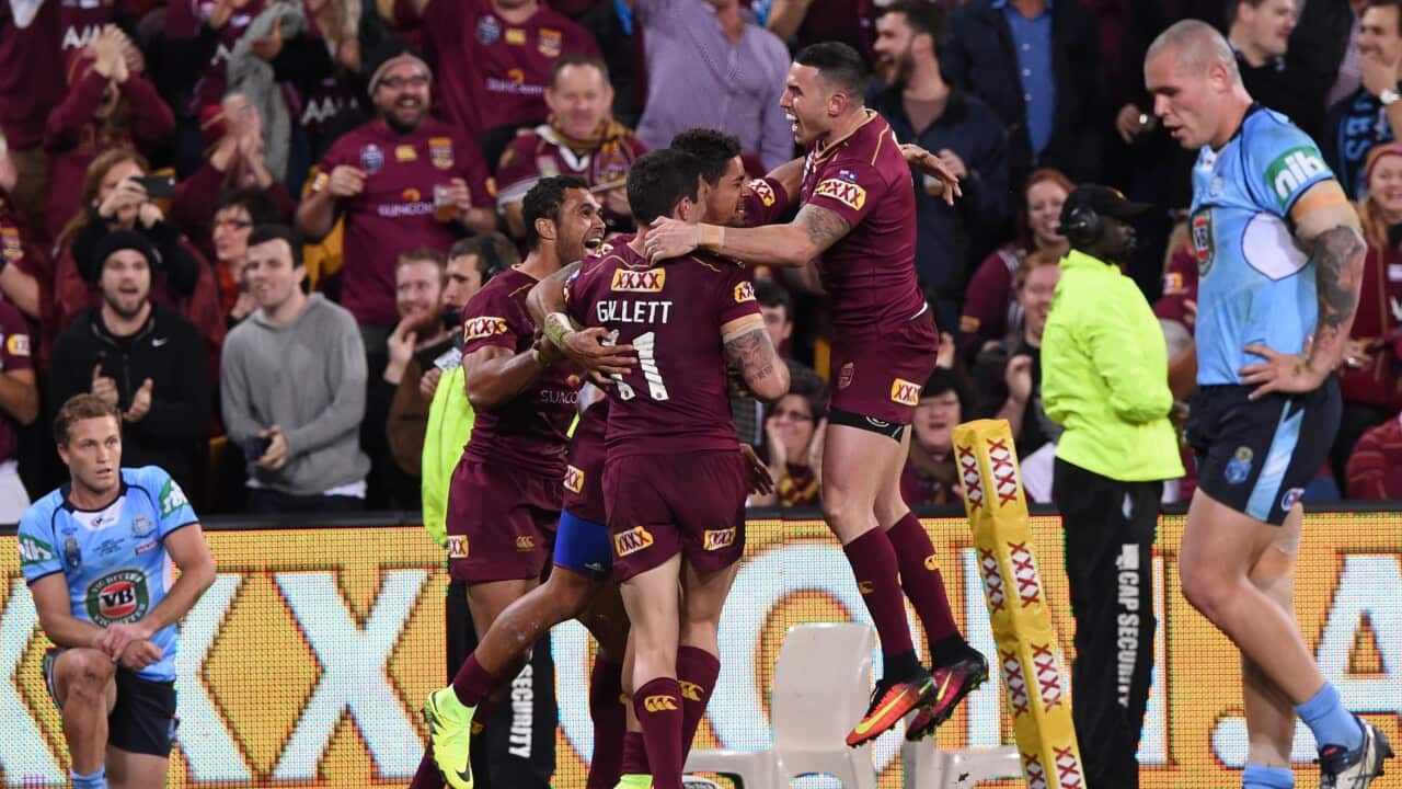 Dane Gagai (centre) of the Maroons celebrates after scoring a try during Game 2 of the State of Origin series at Suncorp Stadium in Brisbane