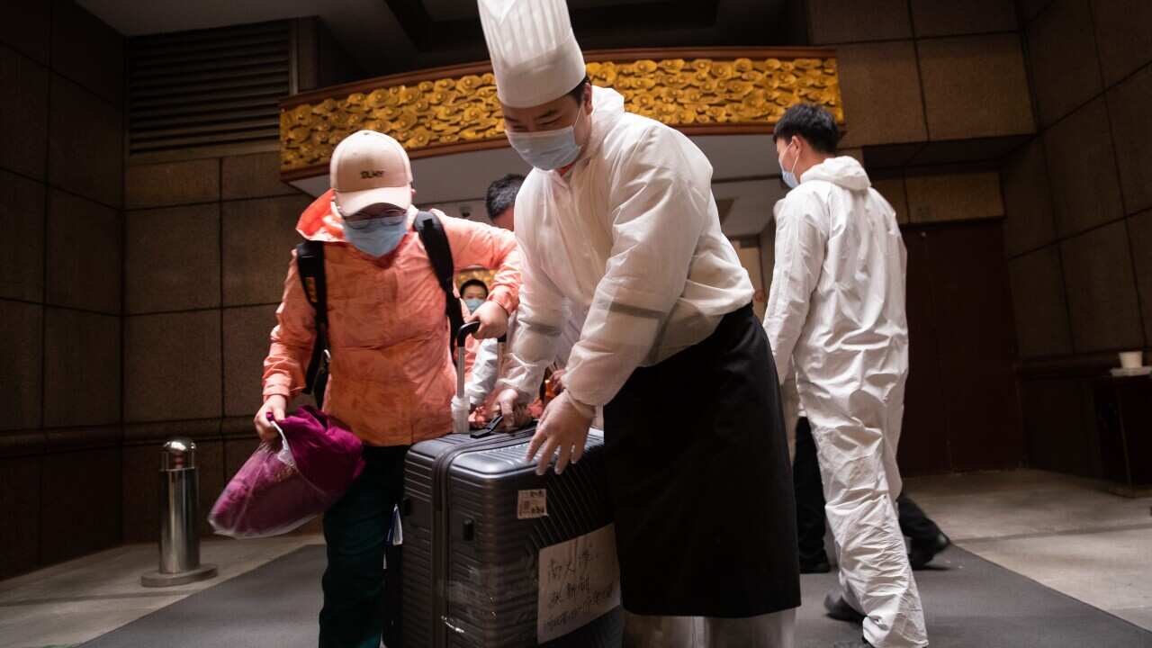 Staff at wuhan tianhe airport lined up to send off members of the hebei medical aid team. Wuhan, hubei province, China.