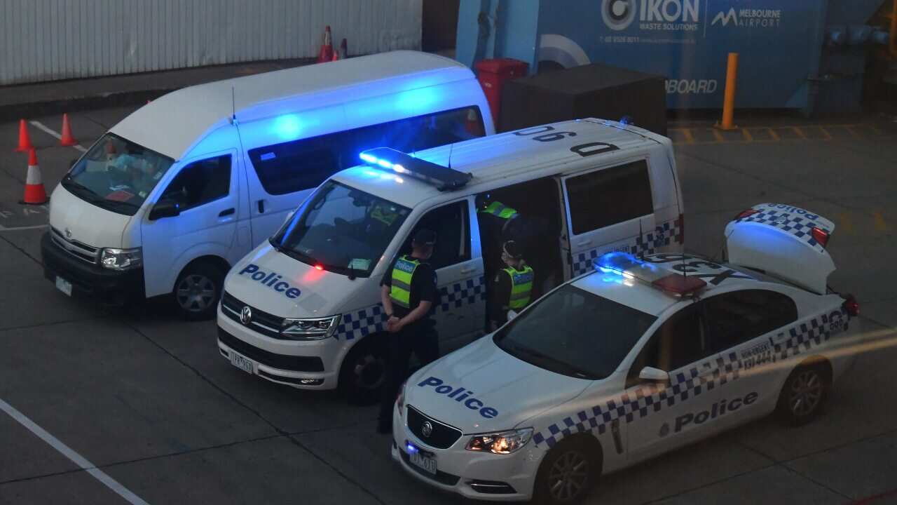 Victorian Police are seen at Melbourne International Airport as Malka Leifer is reported to have arrived on Wednesday, January 27.