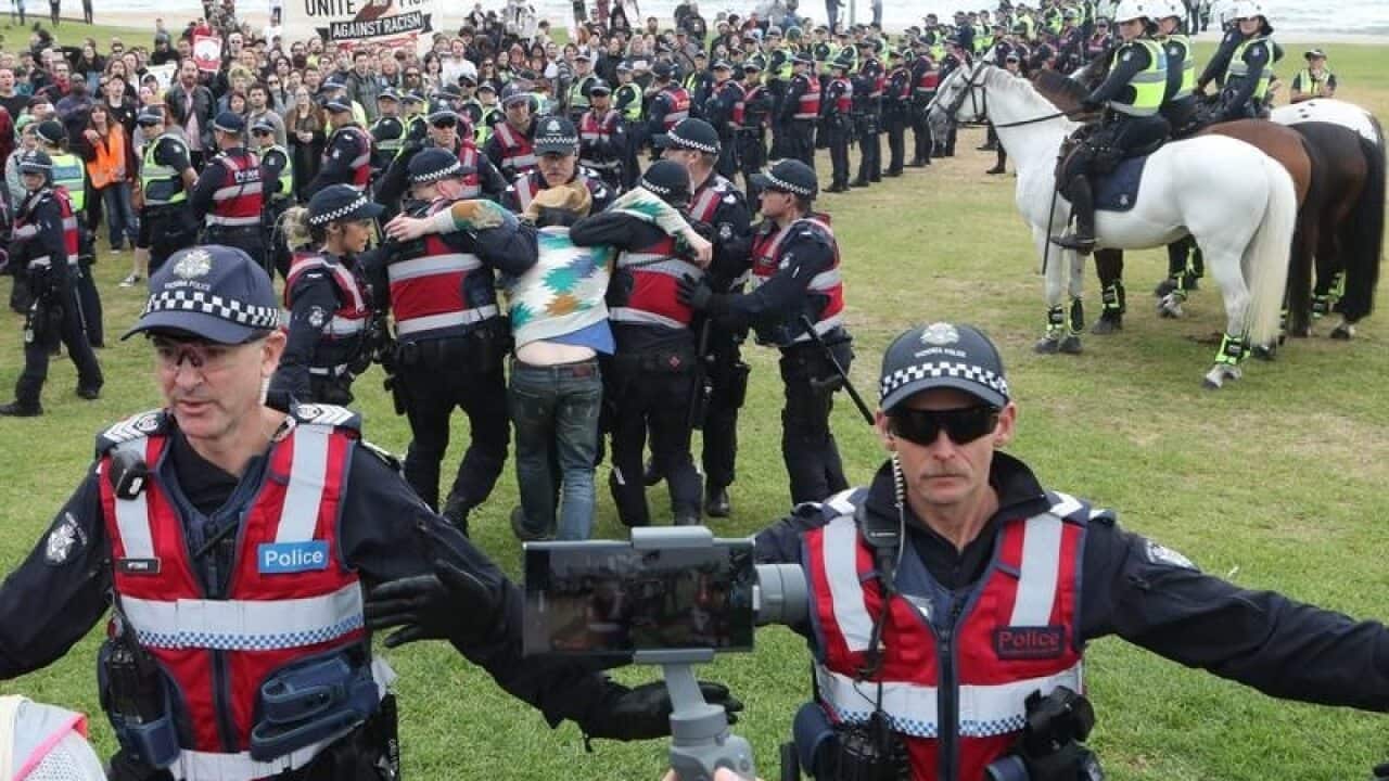 Police keep protesters apart on St Kilda foreshore