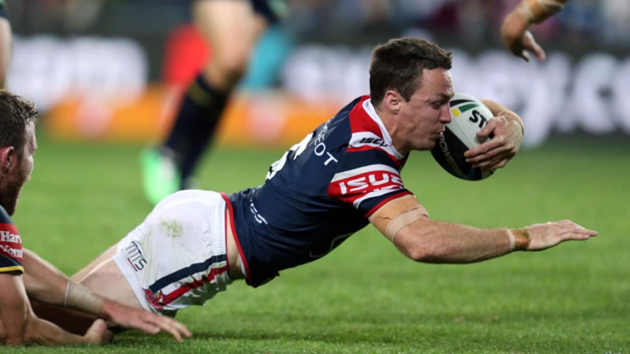 James Maloney of the Roosters scores a try.