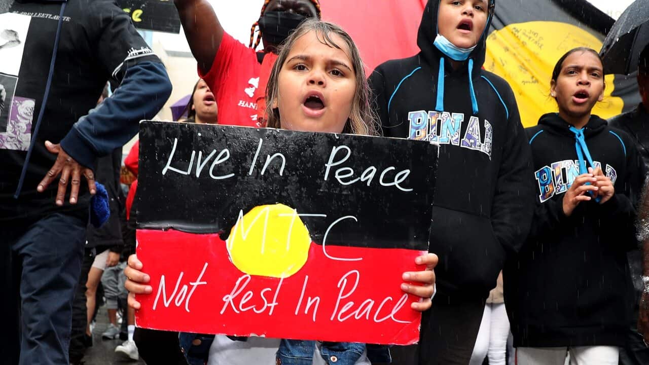 Protesters participate in a Black Lives Matter rally in Perth, Saturday, June 12, 2020. The protest is to raise awareness of Aboriginal Deaths in Custody. (AAP Image/Richard Wainwright) NO ARCHIVING