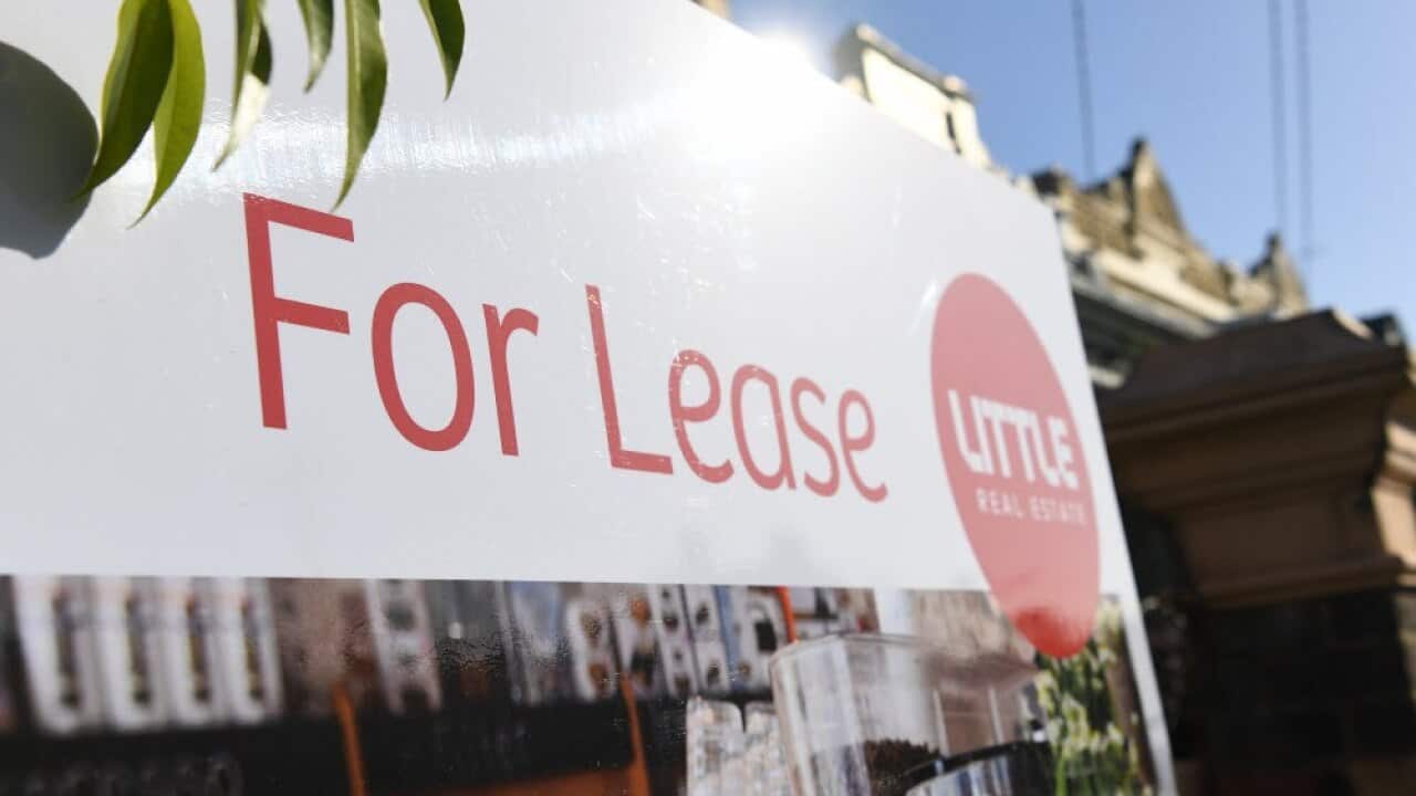 Signage for a real estate property is seen in Carlton North, Melbourne, Wednesday, July 18, 2018.