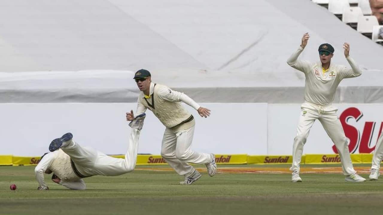Usman Khawaja of Australia drop a catch.