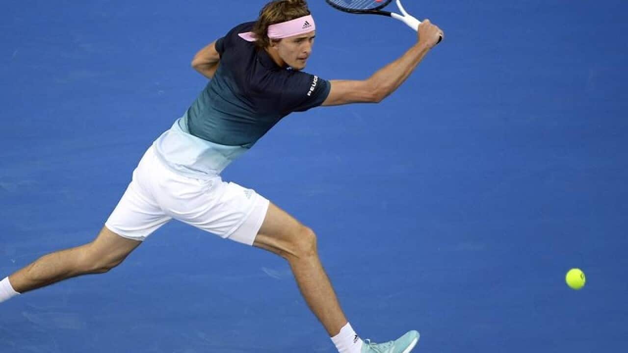 Germany's Alexander Zverev makes a backhand return.