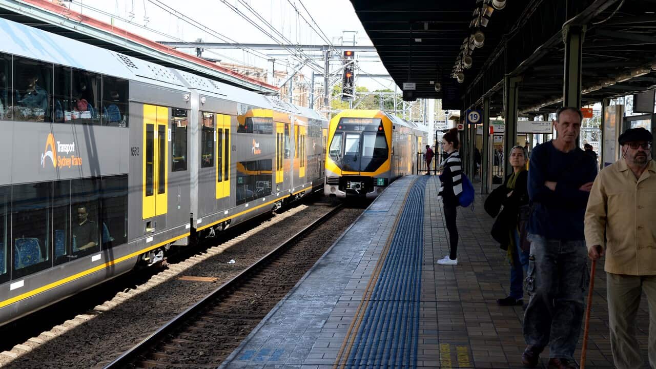 Sydney Trains and commuters at Central railway station.