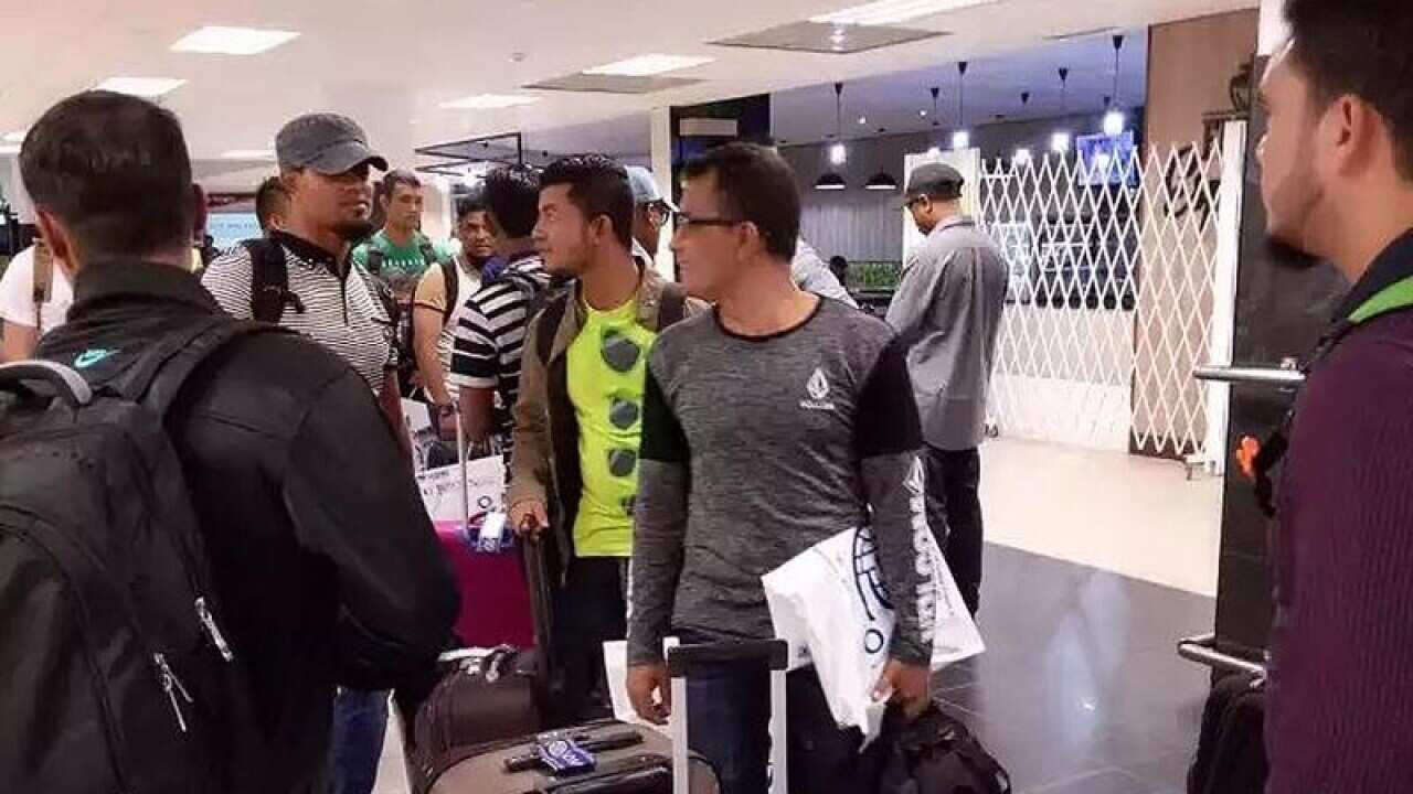 A group of refugees at Port Moresby airport
