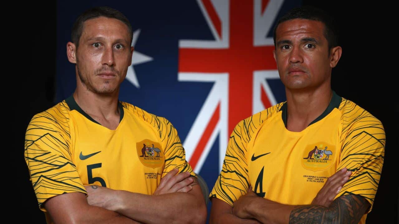 Mark Milligan and Tim Cahill of Australia pose during the Australian Socceroos.