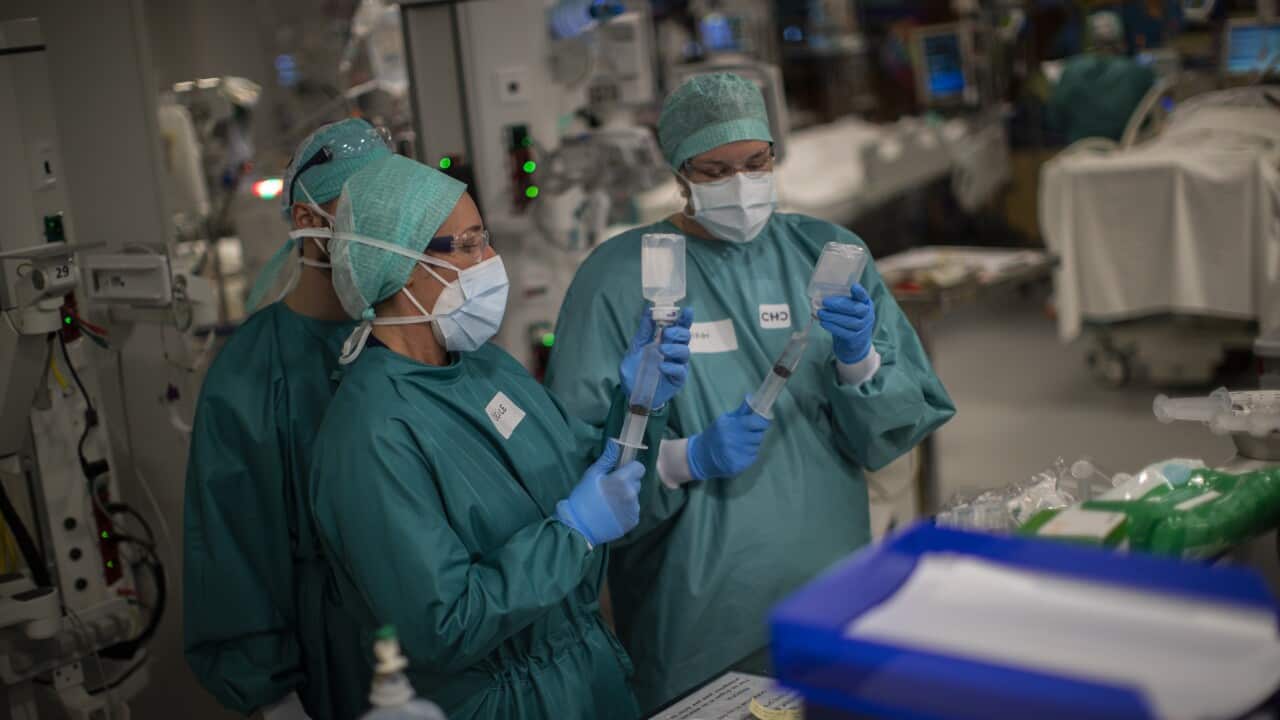 Medical personnel work in the intensive care ward for COVID-19 patients at the MontLegia CHC hospital in Liege, Belgium, Friday, 6 November, 2020.
