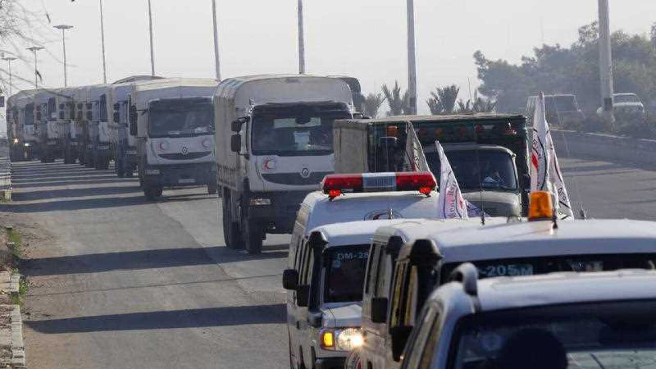 A convoy of trucks loaded with humanitarian supplies are seen heading to the besieged town of Madaya, some 24 kilometers in southwest Damascus
