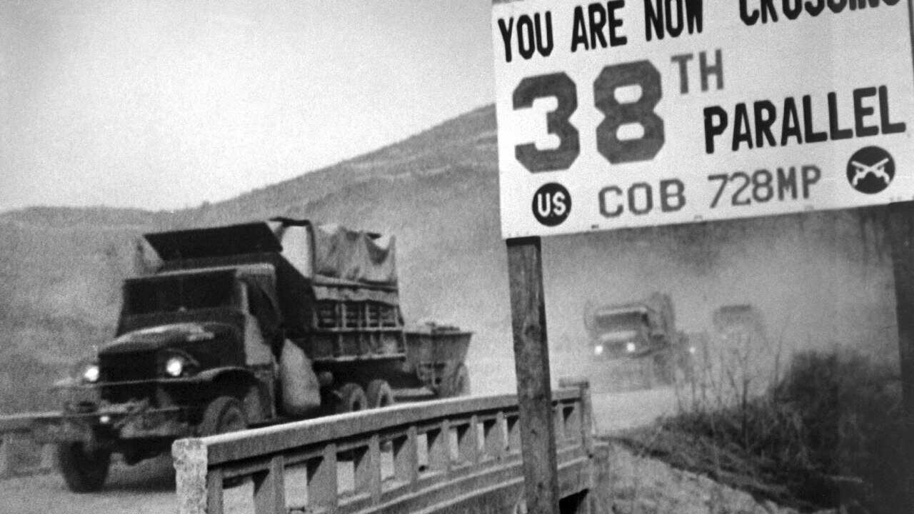 United Nations forces, traveling in trucks, cross the 38th parallel
