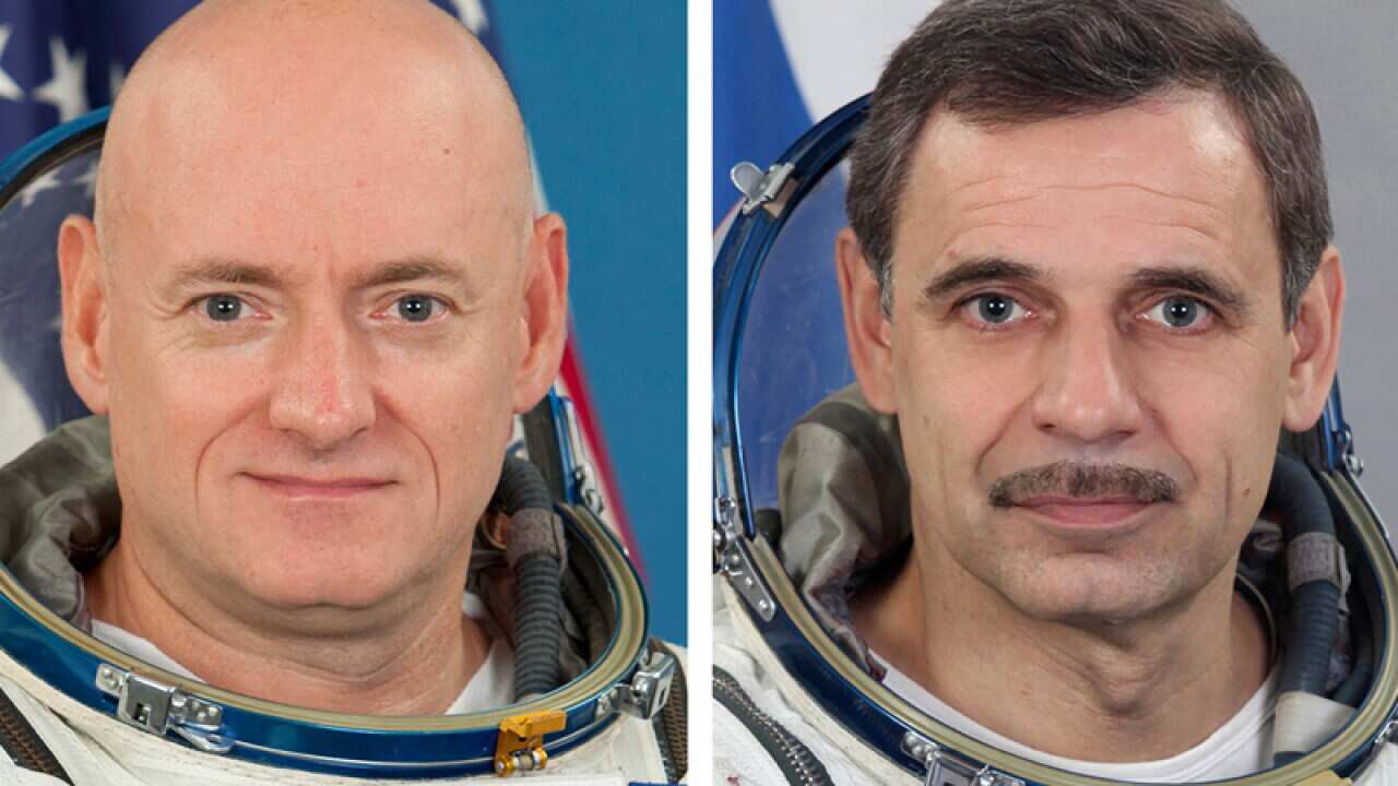 Astronauts Scott Kelly (L) and Mikhail Kornienko