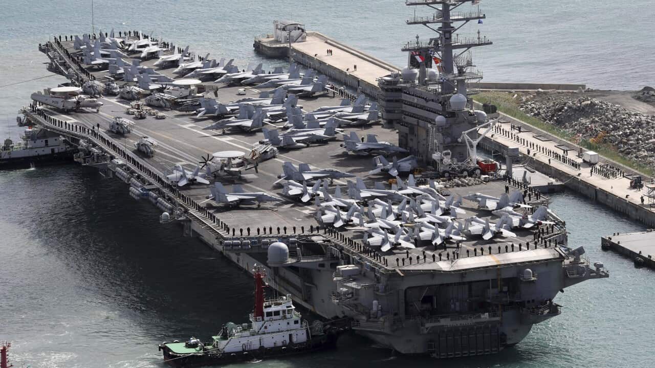 (File Image) The aircraft carrier USS Ronald Reagan is escorted into Busan port, South Korea.