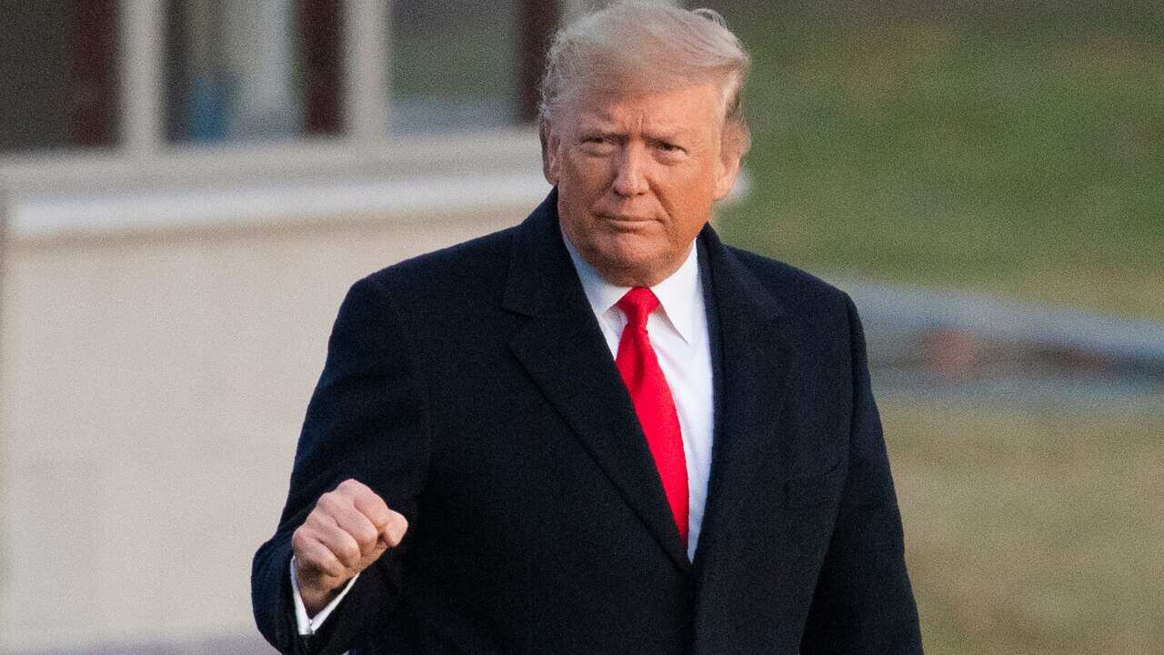 President Donald Trump pictured leaving the White House just hours before he was impeached in a historic vote.