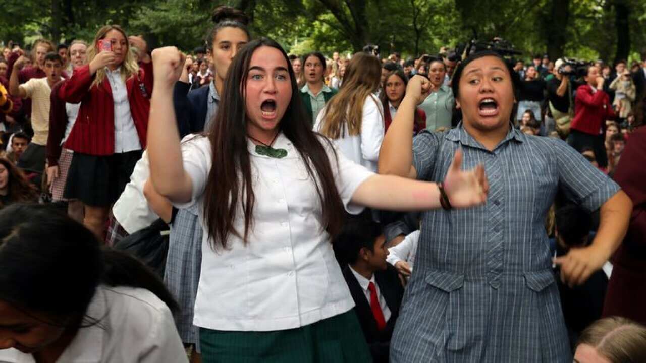 Students perform the Haka during a vigil to commemorate victims of Friday's shooting, outside the Al Noor mosque in Christchurch, New Zealand.