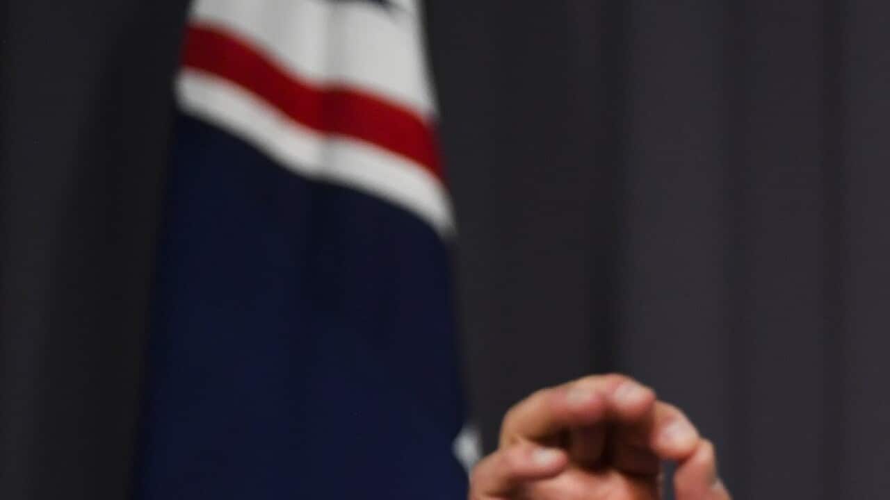 Australian Treasurer Josh Frydenberg addresses the media during a press conference as he hands down the Mid-Year Economic and Fiscal Outlook (MYEFO) 2021/22 at Parliament House in Canberra, Thursday, December 16, 2021. (AAP Image/Lukas Coch) NO ARCHIVING