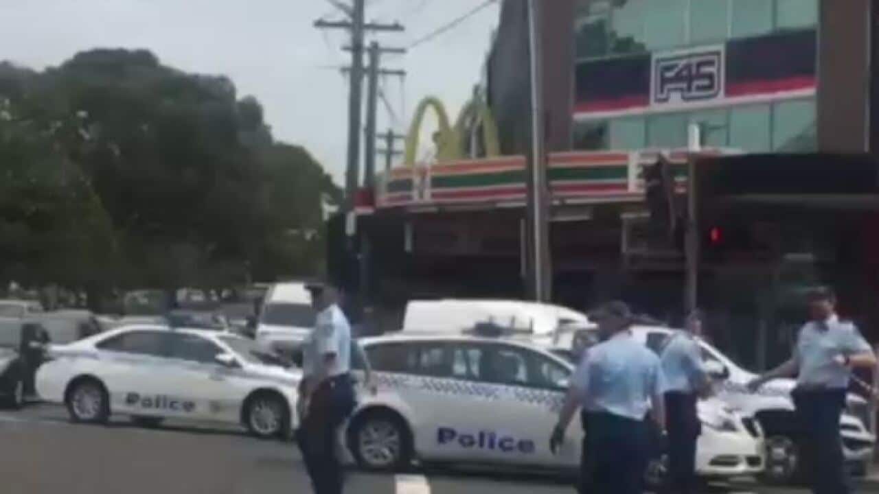 An alleged child sex offender has been shot dead in a Sydney pub after stabbing a policeman who was attempting to arrest him.