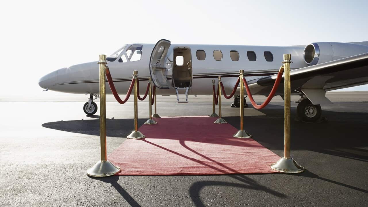 Private airplane with red carpet