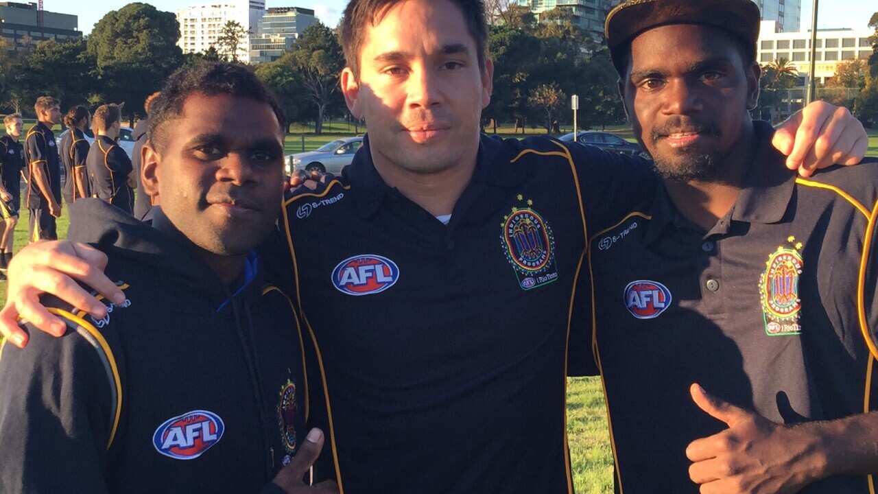 Former AFL player Matthew Stokes (middle) amongst participants