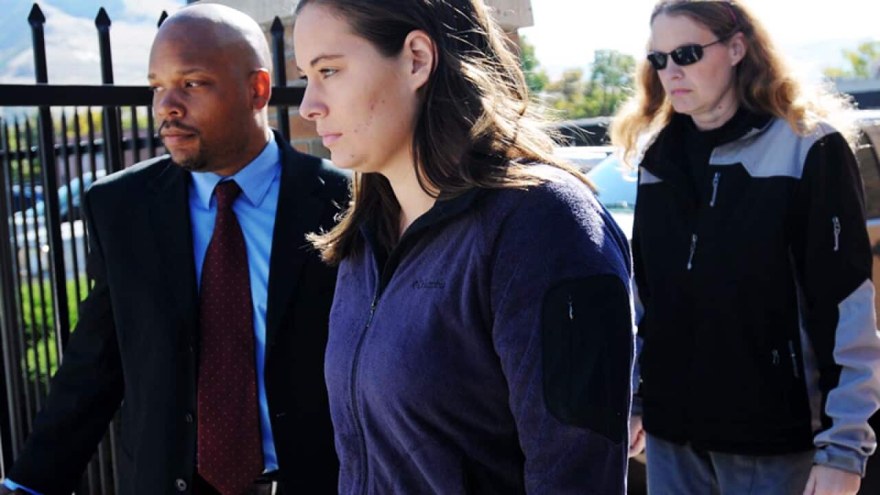 Jordan Linn Graham, center, leaves the federal courthouse.