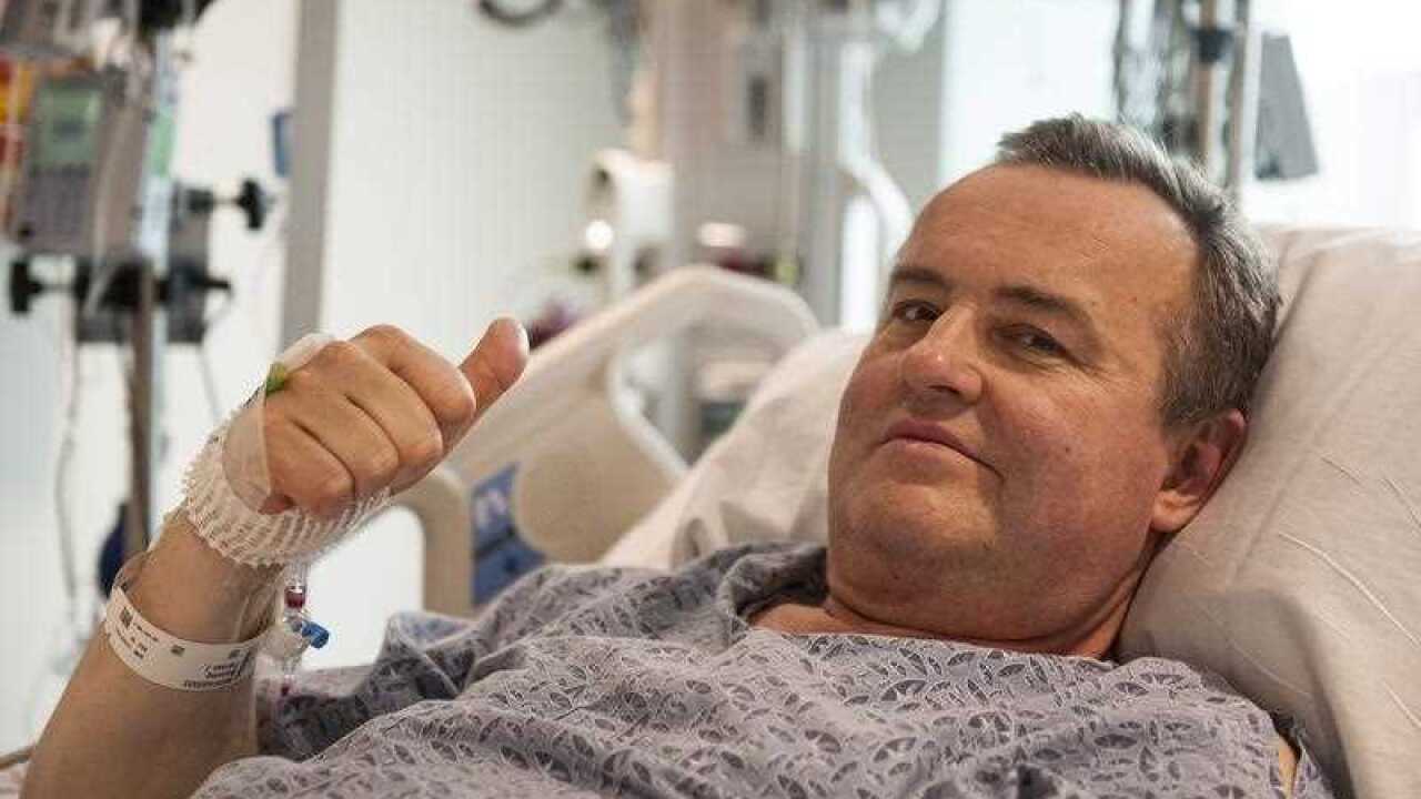 A handout image released by the Massachusetts General Hospital on 16 May 2016 shows Thomas Manning of Massachusetts giving a thumbs up from his hospital bed