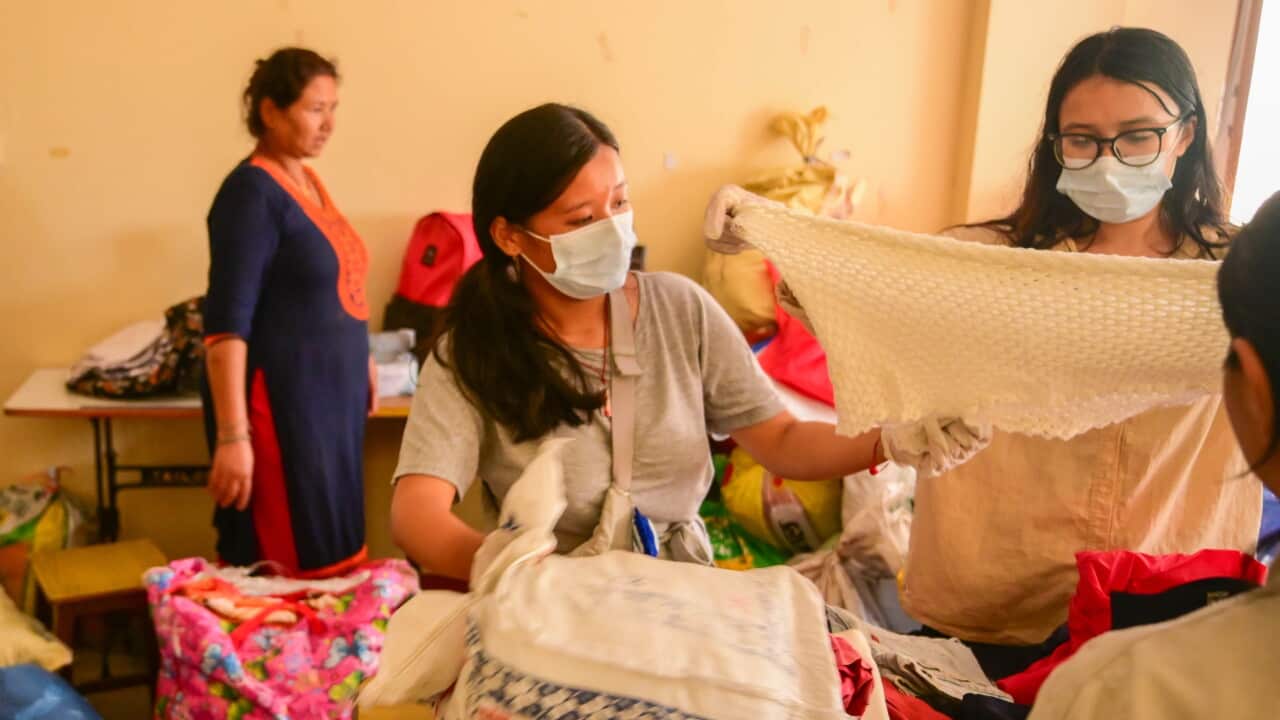 Volunteers prepare relief supplies for Nepal flood victims