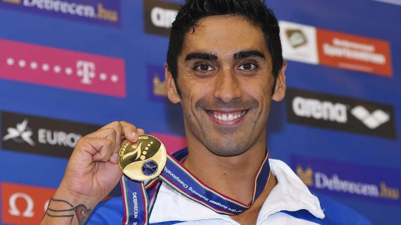 Winner Filippo Magnini of Italy poses with his gold medal.