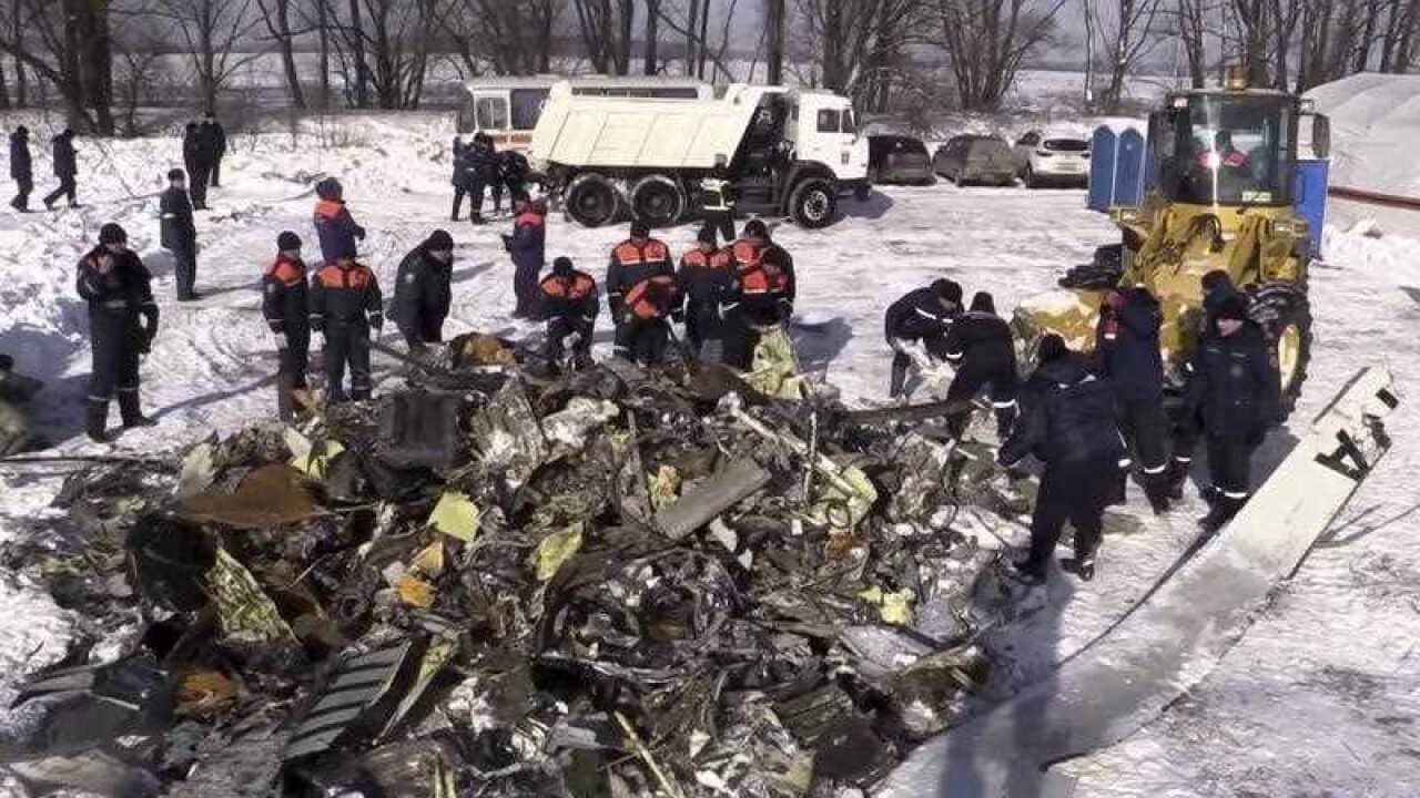 Emergency personnel collect wreckage of an AN-148 plane crash in Stepanovskoye village, about 40 kilometers from the Domodedovo airport, Russia, Tuesday, Feb. 13, 2018.