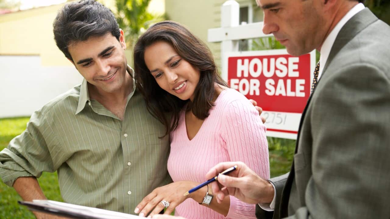 Young couple buying house