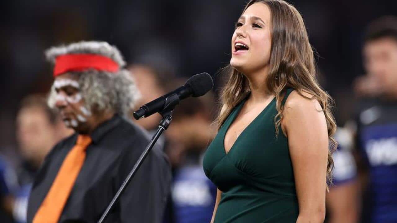 Olivia Fox singing national anthem in Eora language at Sydney's Bankwest Stadium, 05 Dec 2020.