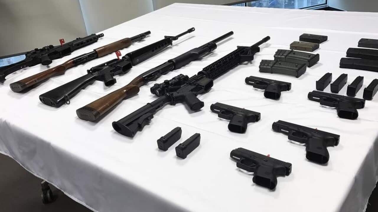 An array of guns in seen on a table in Canberra,