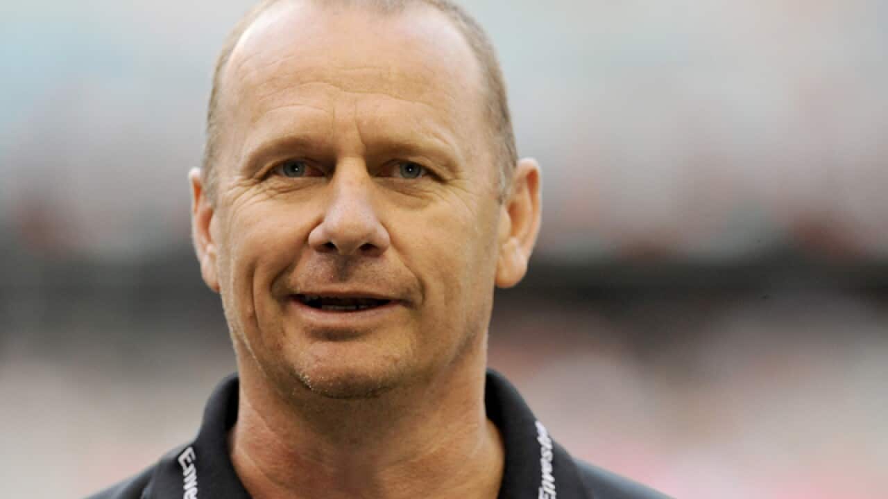 Port Adelaide coach Ken Hinkley watches his side warm up