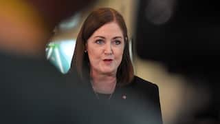 Sarah Henderson in a formal suit.