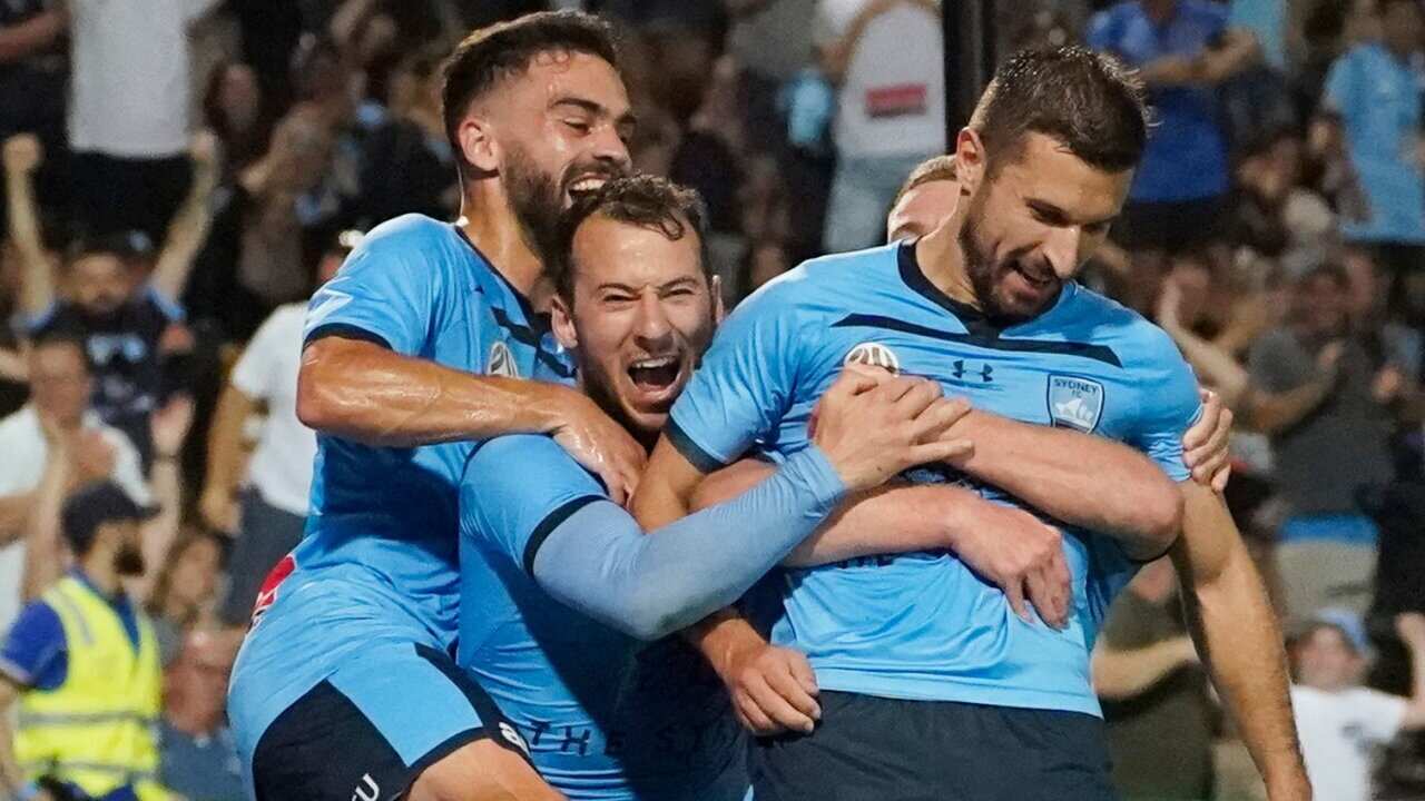Kosta Barbarouses of Sydney FC celebrates a goal with team mates during the match between Sydney FC and Melbourne City FC at Jubilee Stadium in Sydney