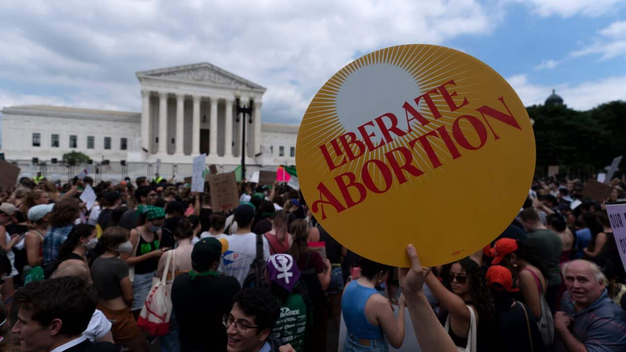 Anti-abortion and abortion rights activists protest outside the Supreme Court in Washington.