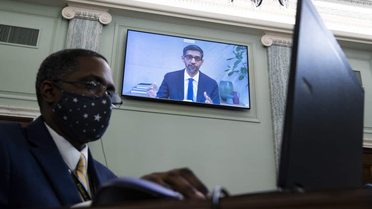 CEO of Alphabet, Sundar Pichai appears on a monitor at the Senate Committee
