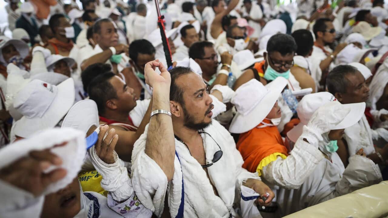 Muslim worshippers from Indonesia throw pebbles as part on the symbolic al-A'qabah at the Jamarat Bridge during the Hajj pilgrimage in Mina, near Mecca.