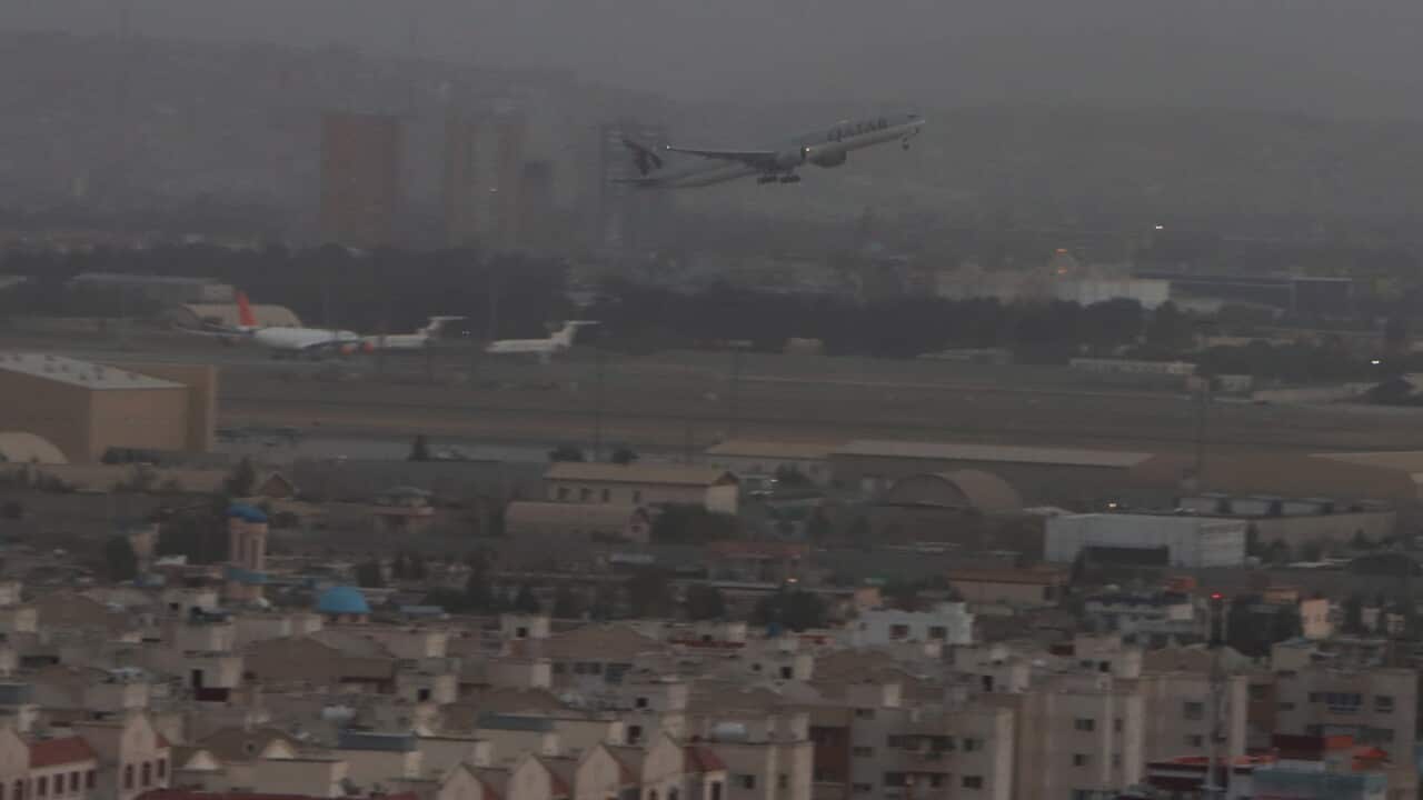 A Qatar Airways flight takes off as international flight operations resumed at Hamid Karzai International Airport in Kabul.