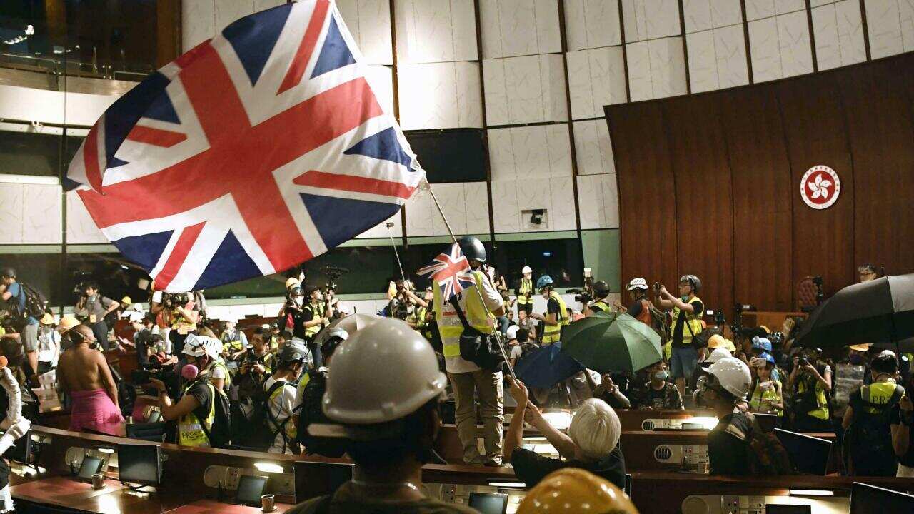 Britain warns China if Hong Kong agreement not honoured as Beijing condemns violence