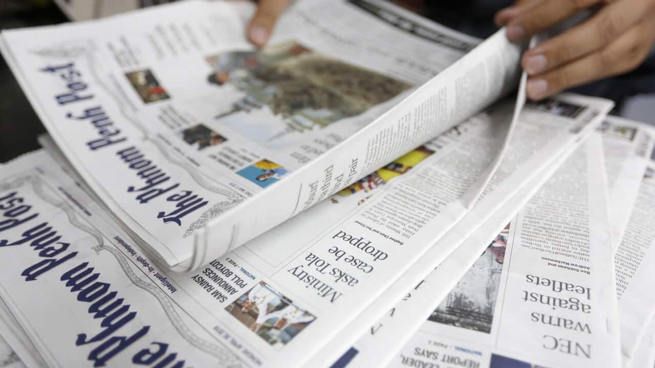 A person reads an issue of The Phnom Penh Post newspaper at an office in Phnom Penh, Cambodia, 07 May 2018.