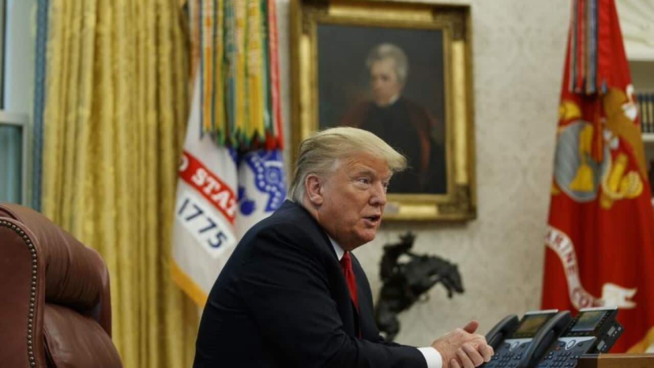 President Donald Trump speaks with an AP in the White House.