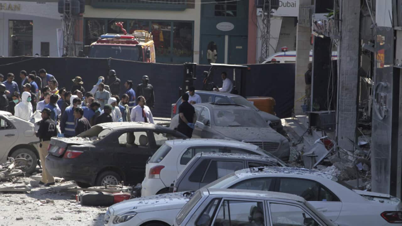 Police cordon off an area following a bomb explosion in Lahore