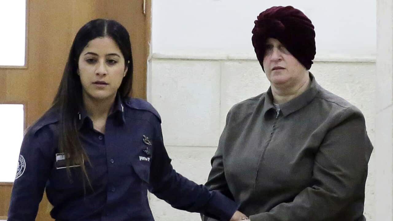 A February 27, 2018 file photo showing Australian Malka Leifer, right, being brought to a courtroom in Jerusalem