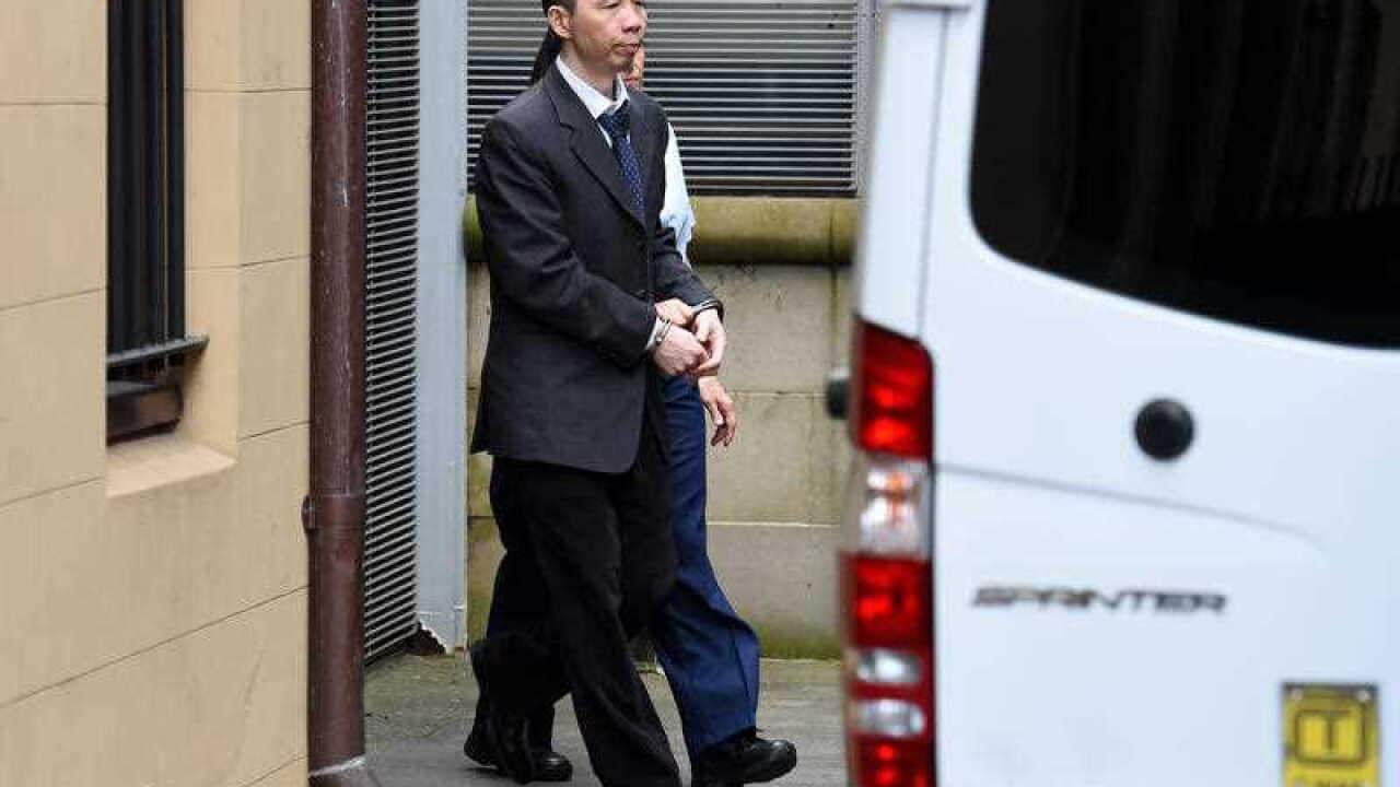 Robert Xie is escorted to prison van at the NSW Supreme Court following closing submissions in his murder trial in Sydney.