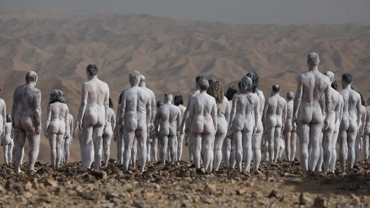 naked people painted white in desert., Spencer Tunick
