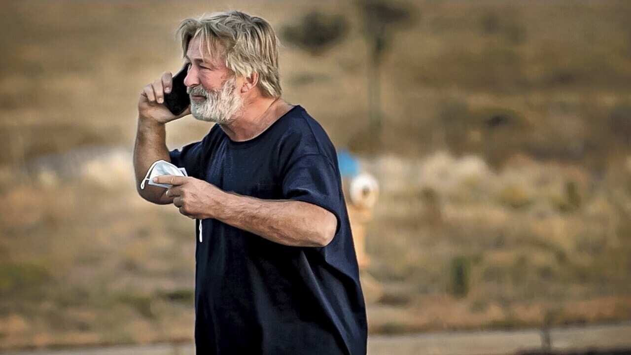 A distraught Alec Baldwin lingers in the parking lot outside the Santa Fe County Sheriff's offices