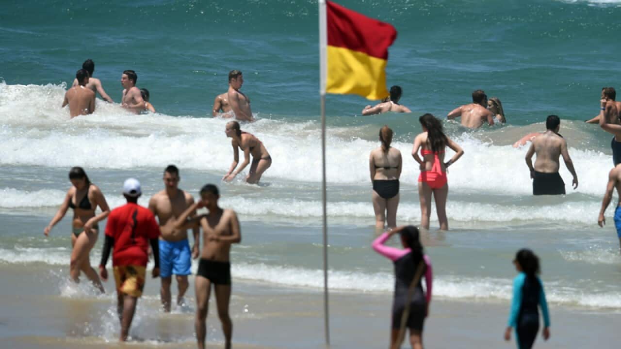 Beachgoers cool down at Surfers Paradise