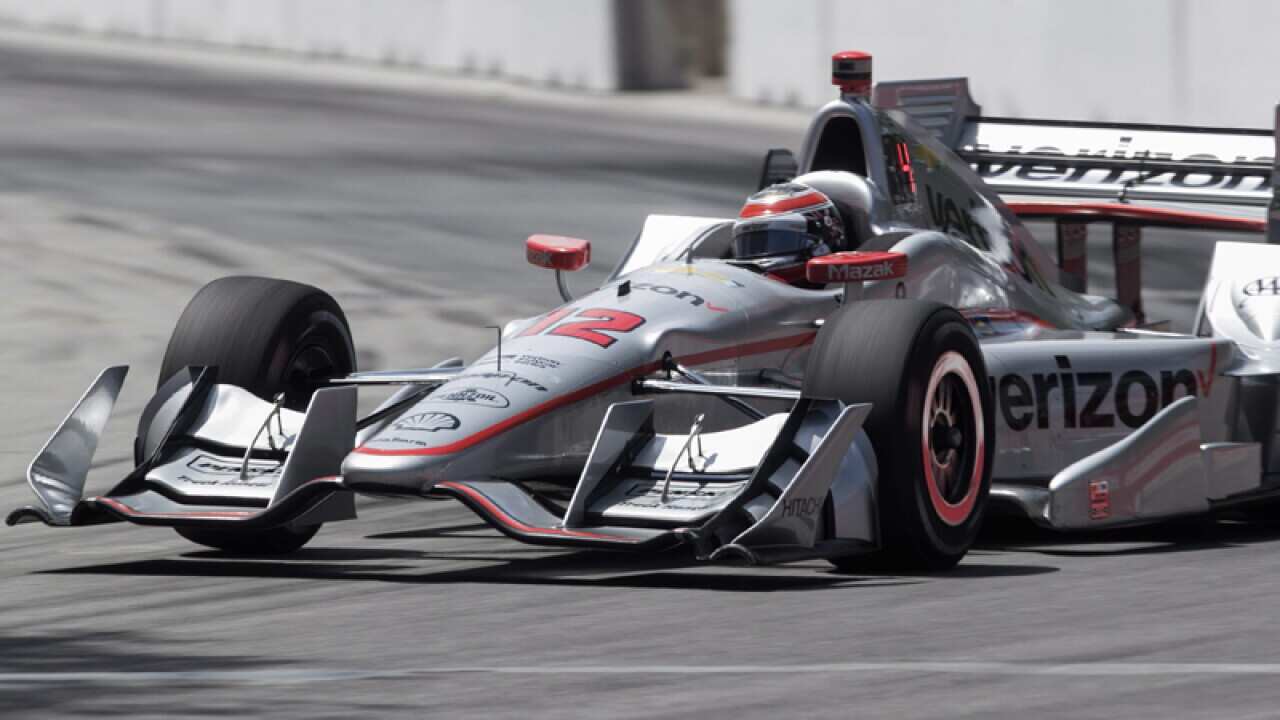 Will Power races during qualifying for the IndyCar auto race